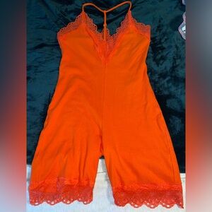 Orange body suit
